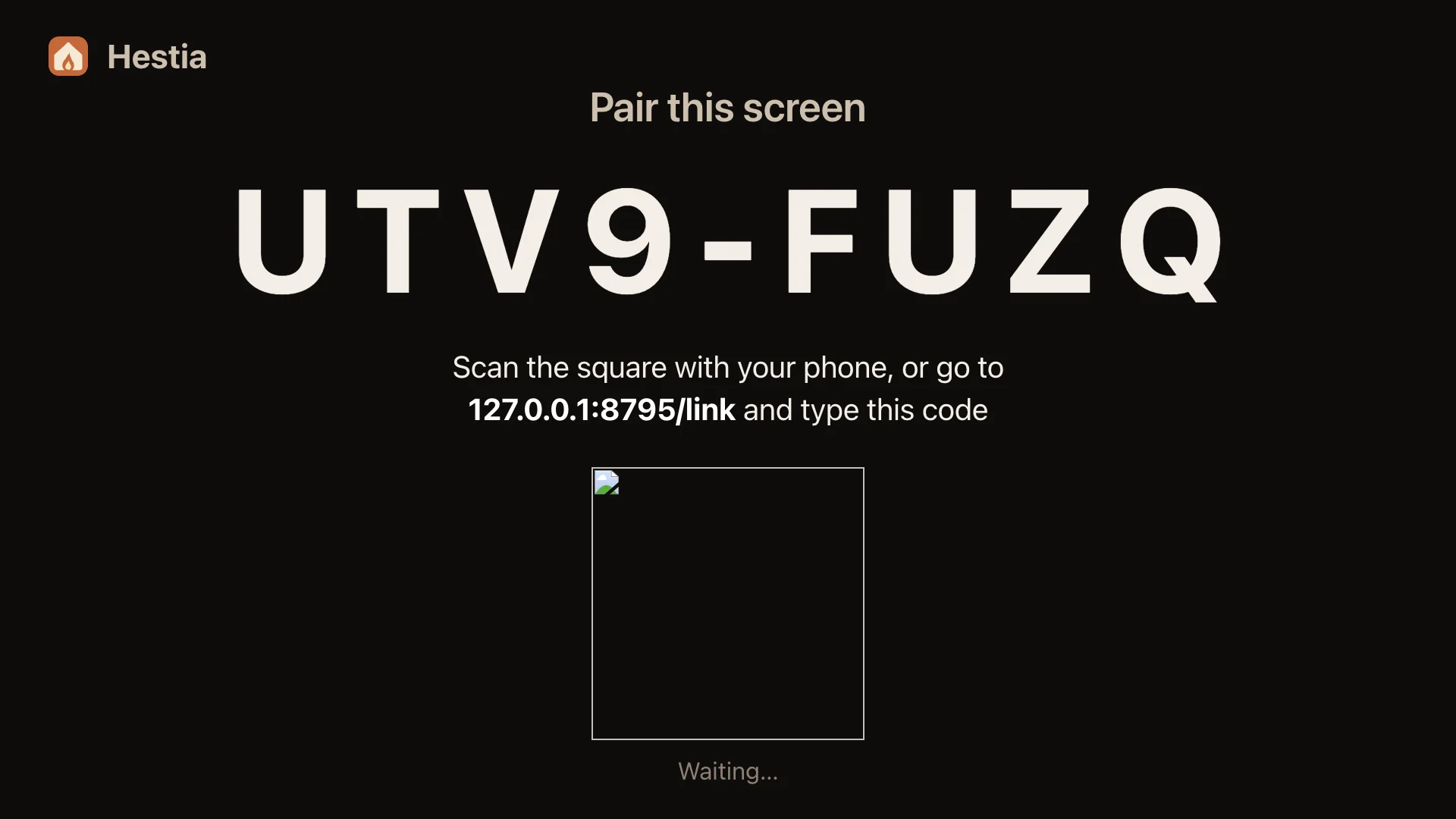 The TV pairing screen with a large code and a QR code.